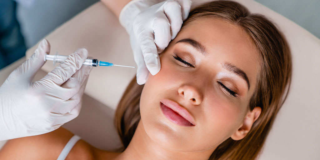 woman getting a facial injection